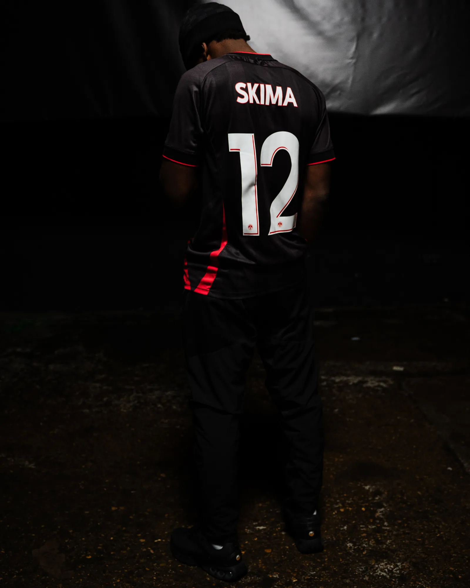 Skima de dos, maillot n°12 floqué à son nom